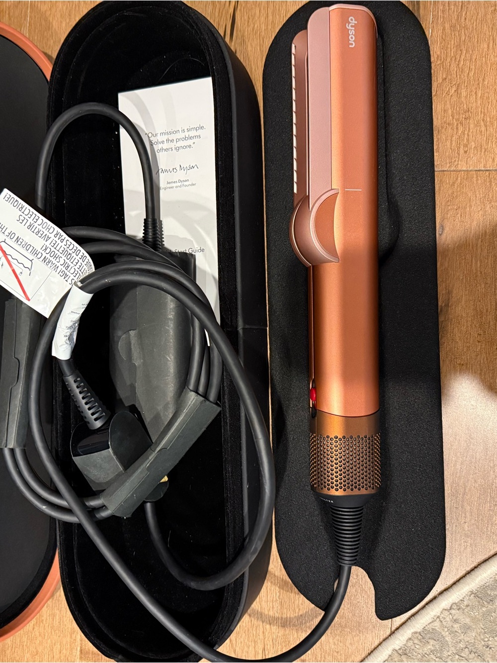 Dyson hair straightener in copper and black